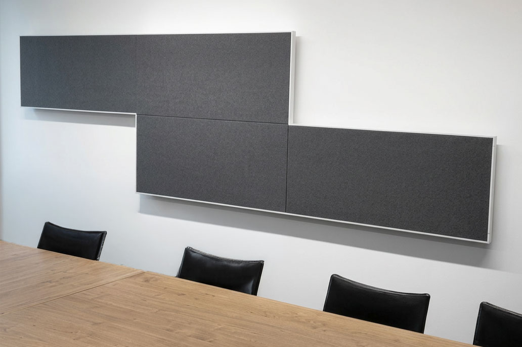 Graue Akustikwandabsorber im Besprechungsraum